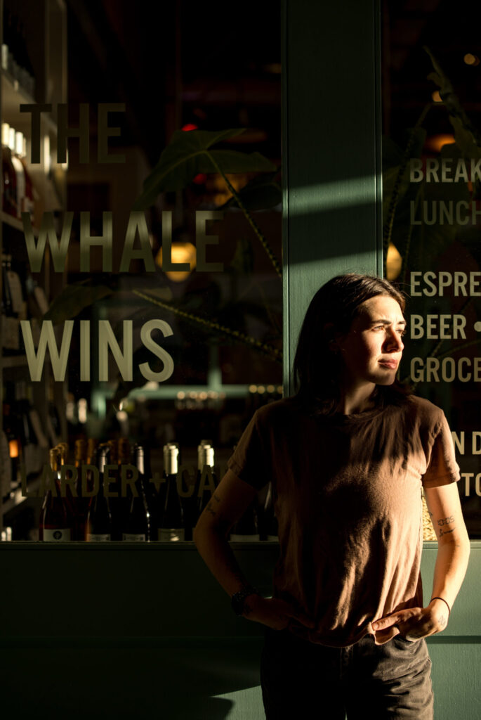 A person casually standing outside a store