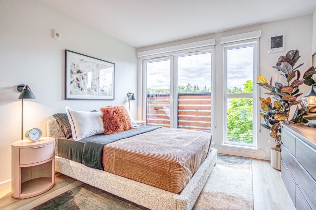 Reed seattle - unit bedroom with balcony view